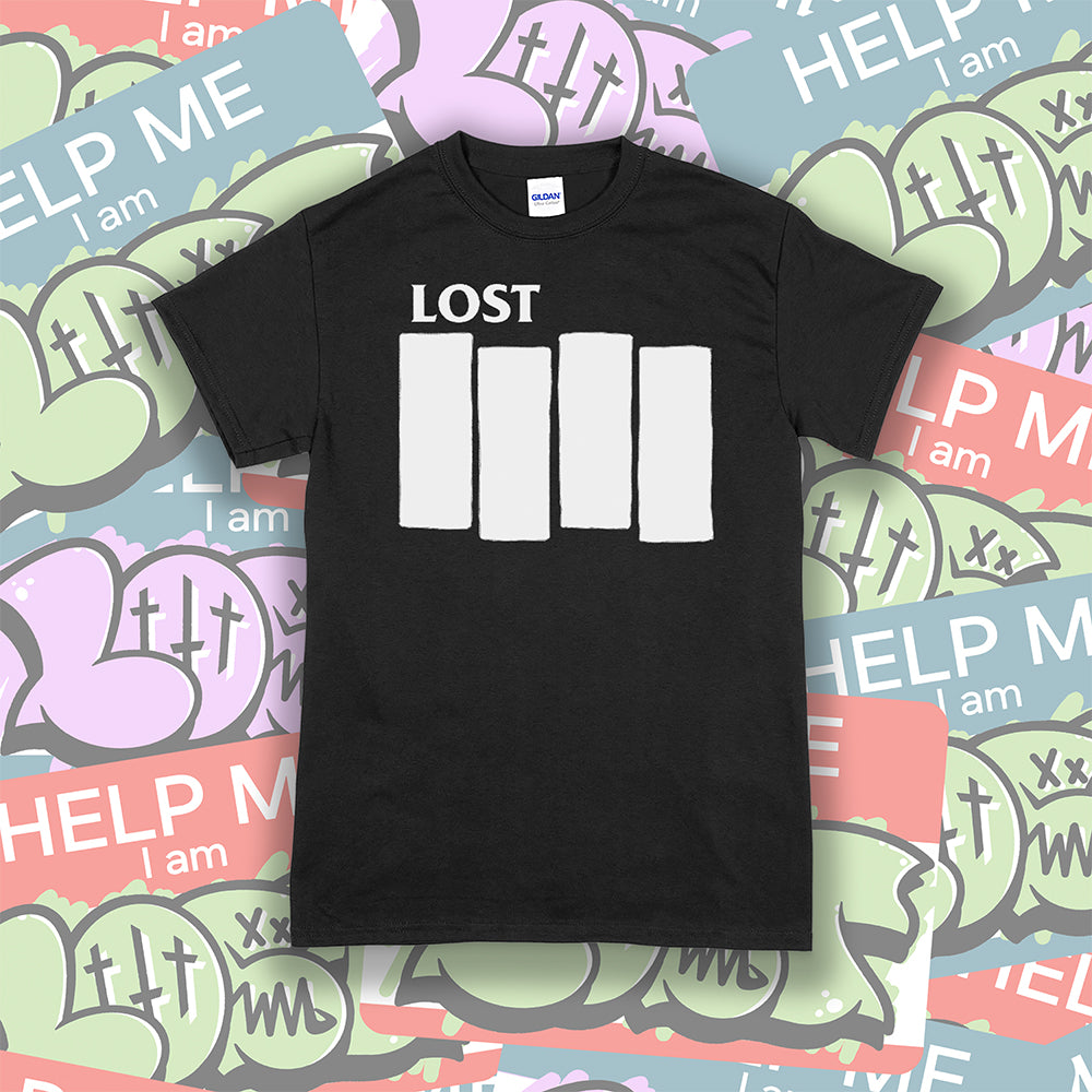 The Lost Flag t-shirt. The iconic bold logo is screen printed in white ink on a black cotton shirt. A collection of colorful graffiti stickers make up the background.