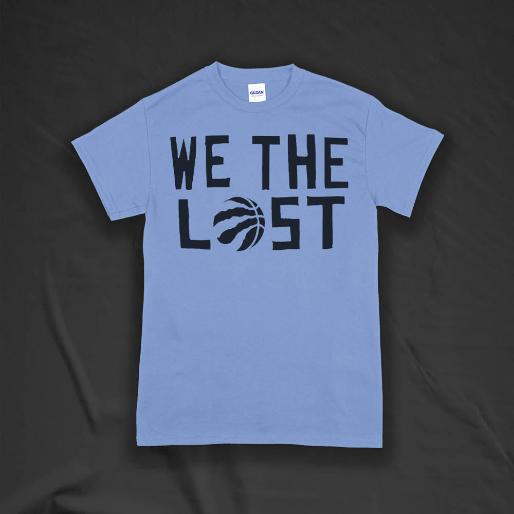 We The Lost t-shirt. Bold black lettering screen printed on a light blue shirt.