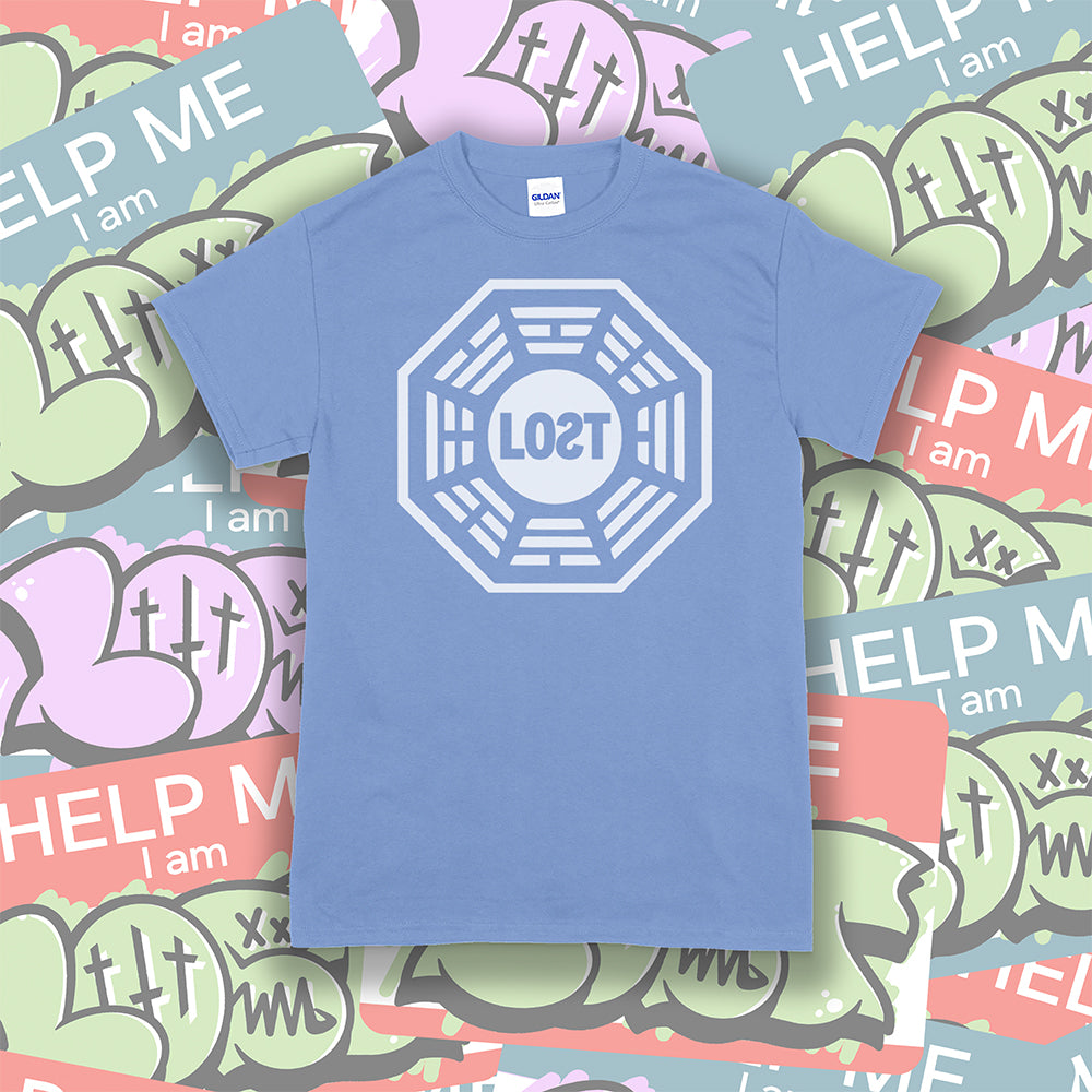 The Lost Initiative t-shirt with a large solid white logo screen printed on a light blue shirt. A collection of colorful LOST graffiti stickers make up the background.